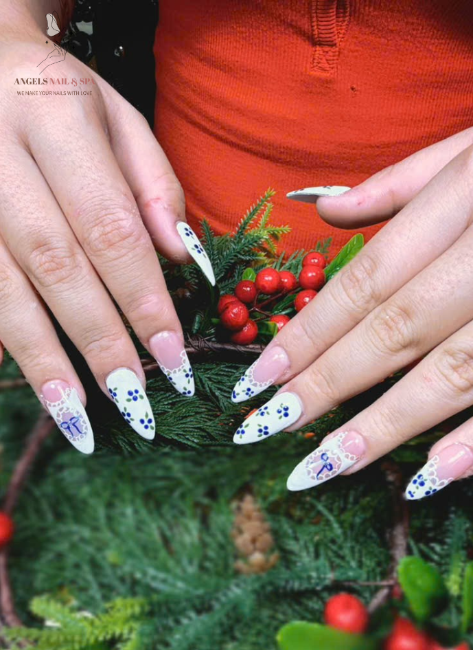 stylish holiday nails at nail salon in Yarmouth with white and blue details