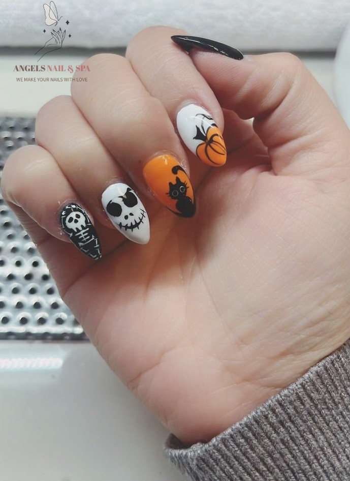 Halloween nails with pumpkin skull ghost black white orange nail design Yarmouth