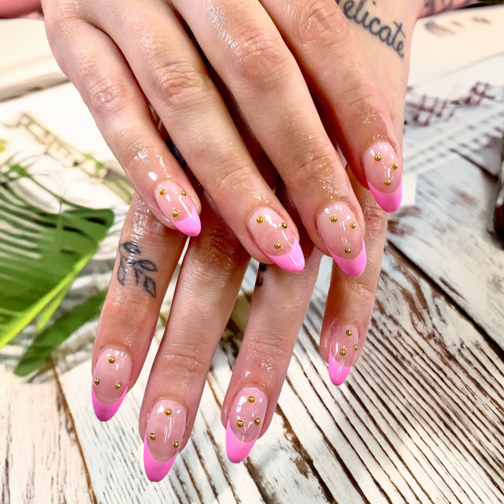 pink summer nails in Yarmouth with gold stud accents