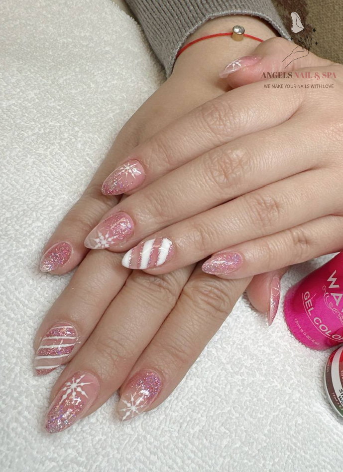 creative nail design in Yarmouth with pink swirl art and glitter details