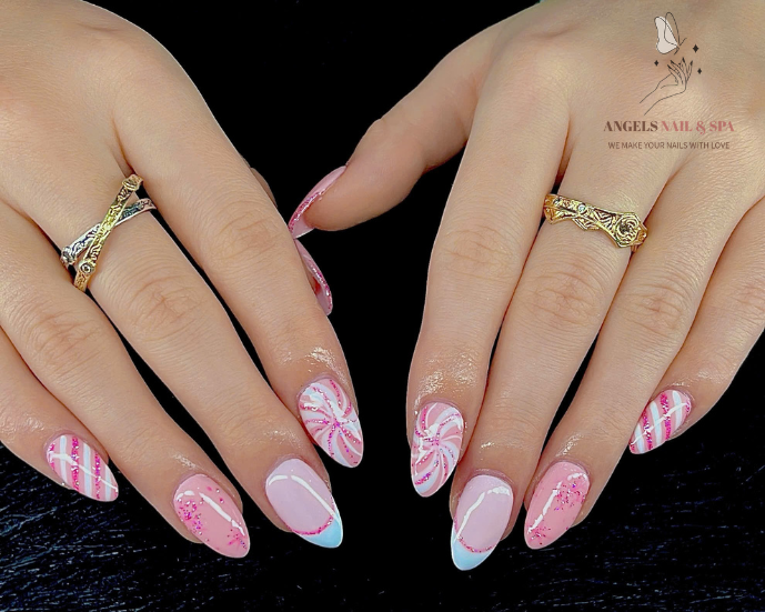 cute swirl nail design in Yarmouth with pink candy pattern and glitter accents