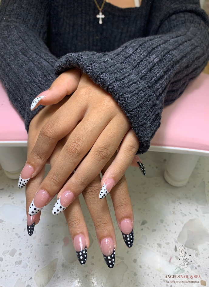 trendy nail design with polka dots and nude base at nail salon in Yarmouth