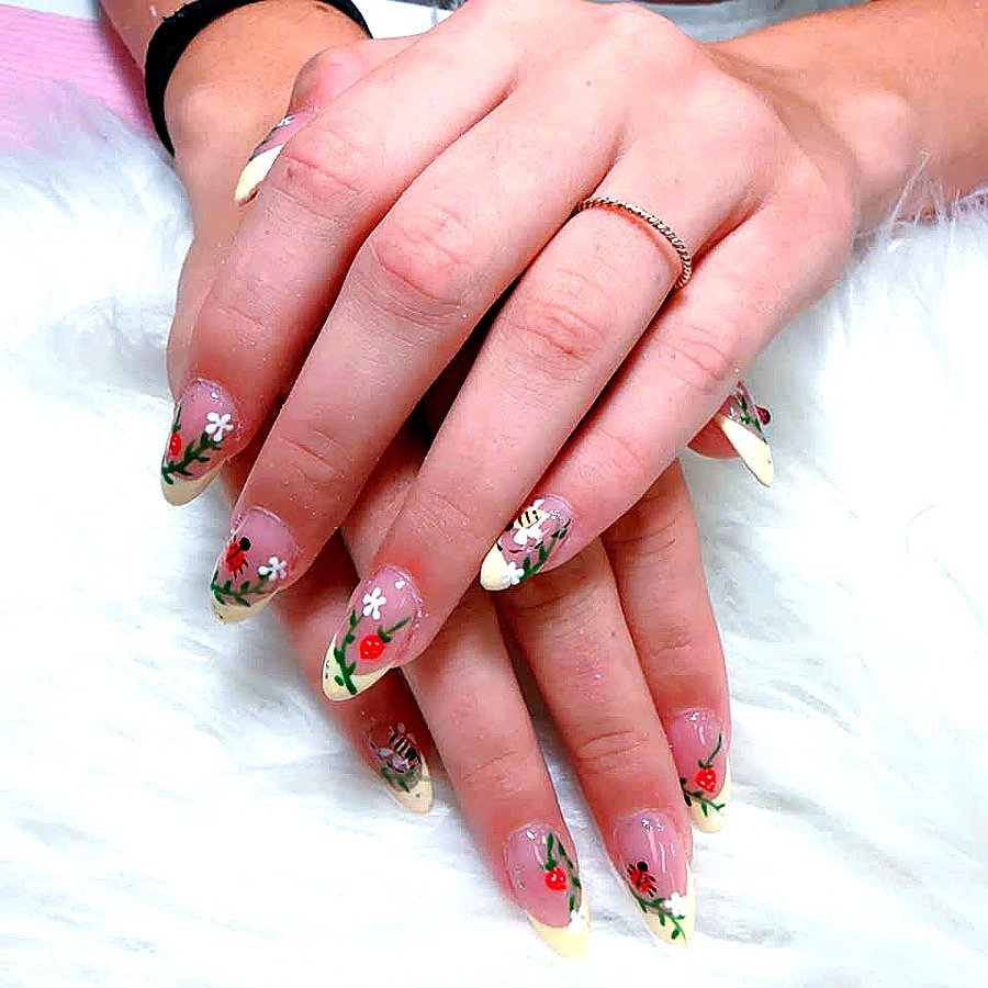 Garden art French tip nails with ladybug bee strawberry by Angels Nail & Spa in Yarmouth NS