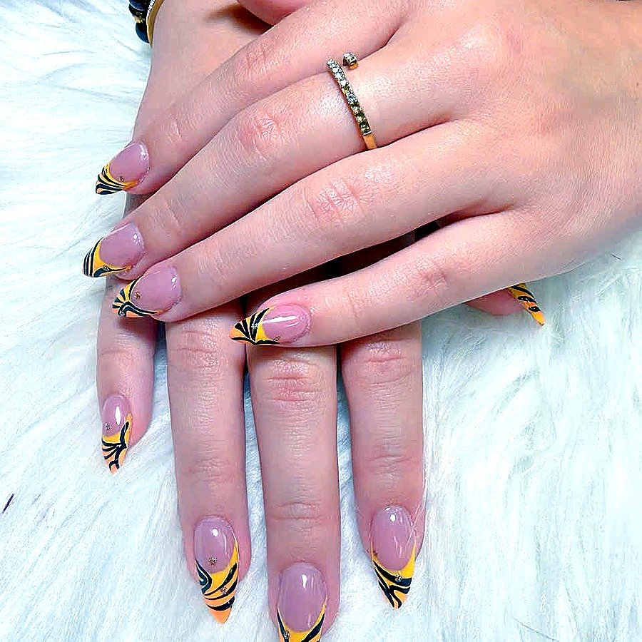 Tiger flame French tip stiletto nail art by Angels Nail & Spa in Yarmouth NS
